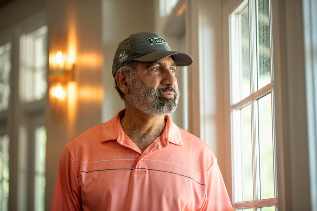 A photo of a man standing infoor